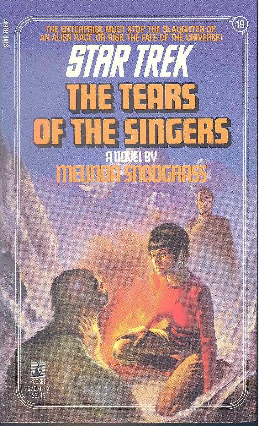 Cover of Tears of the Singers, showing Uhura near a campfire with a seal-like alien