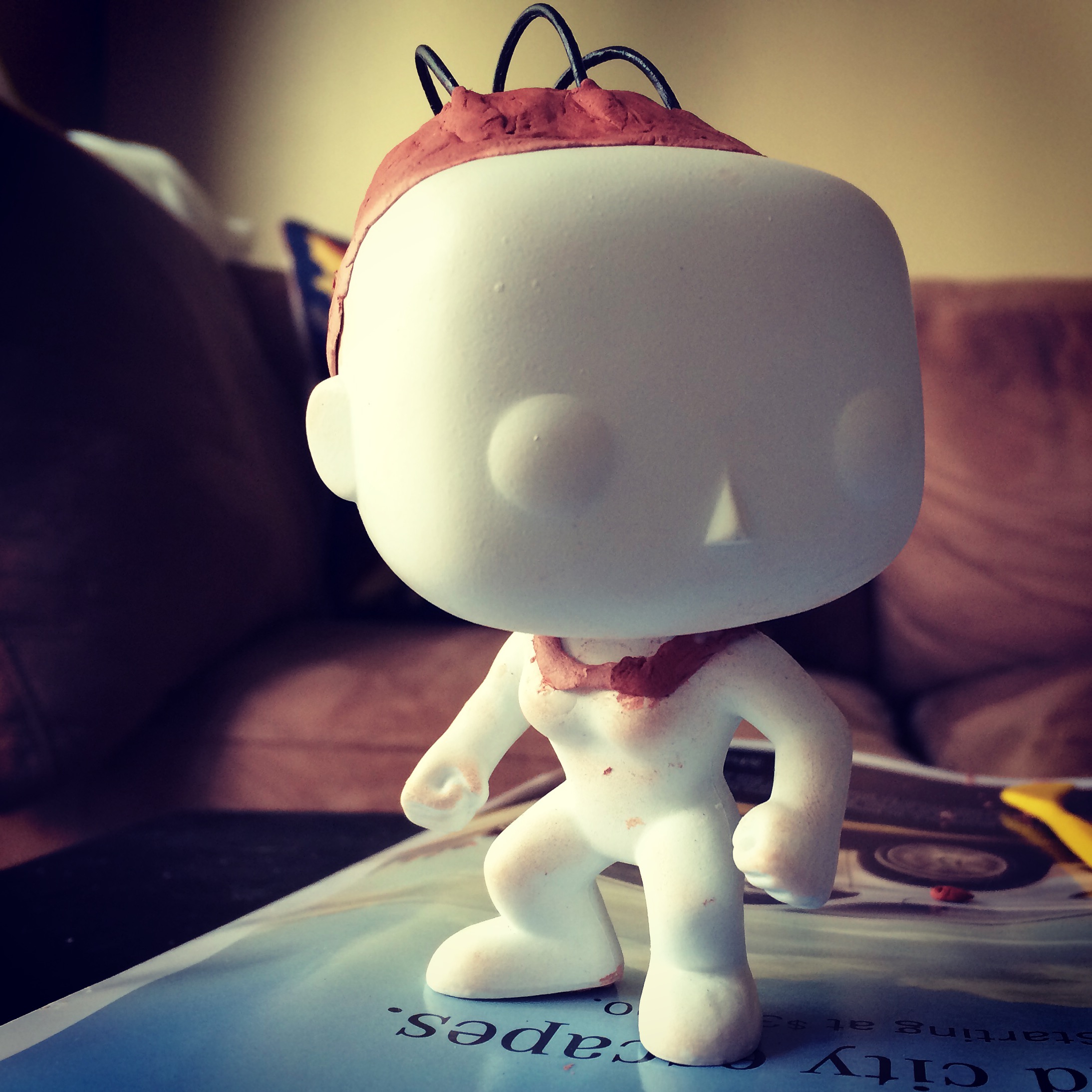 Stage 1 of Funko - blank with clay collar and head with wires