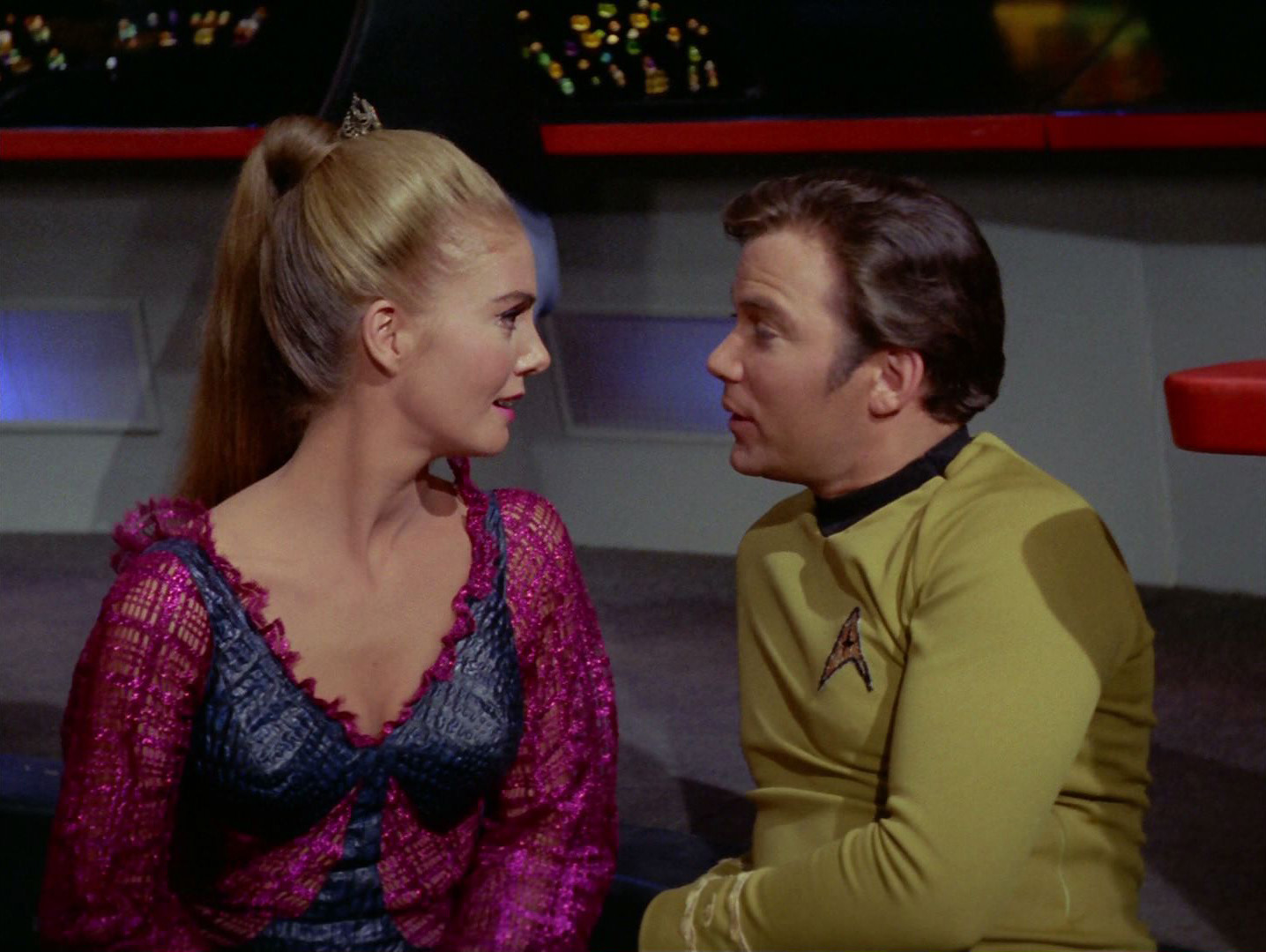 Kirk and Odonna make eyes at each other on the bridge