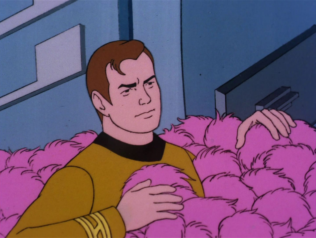 Kirk in a pile of pink tribbles in "More Tribbles, More Troubles"